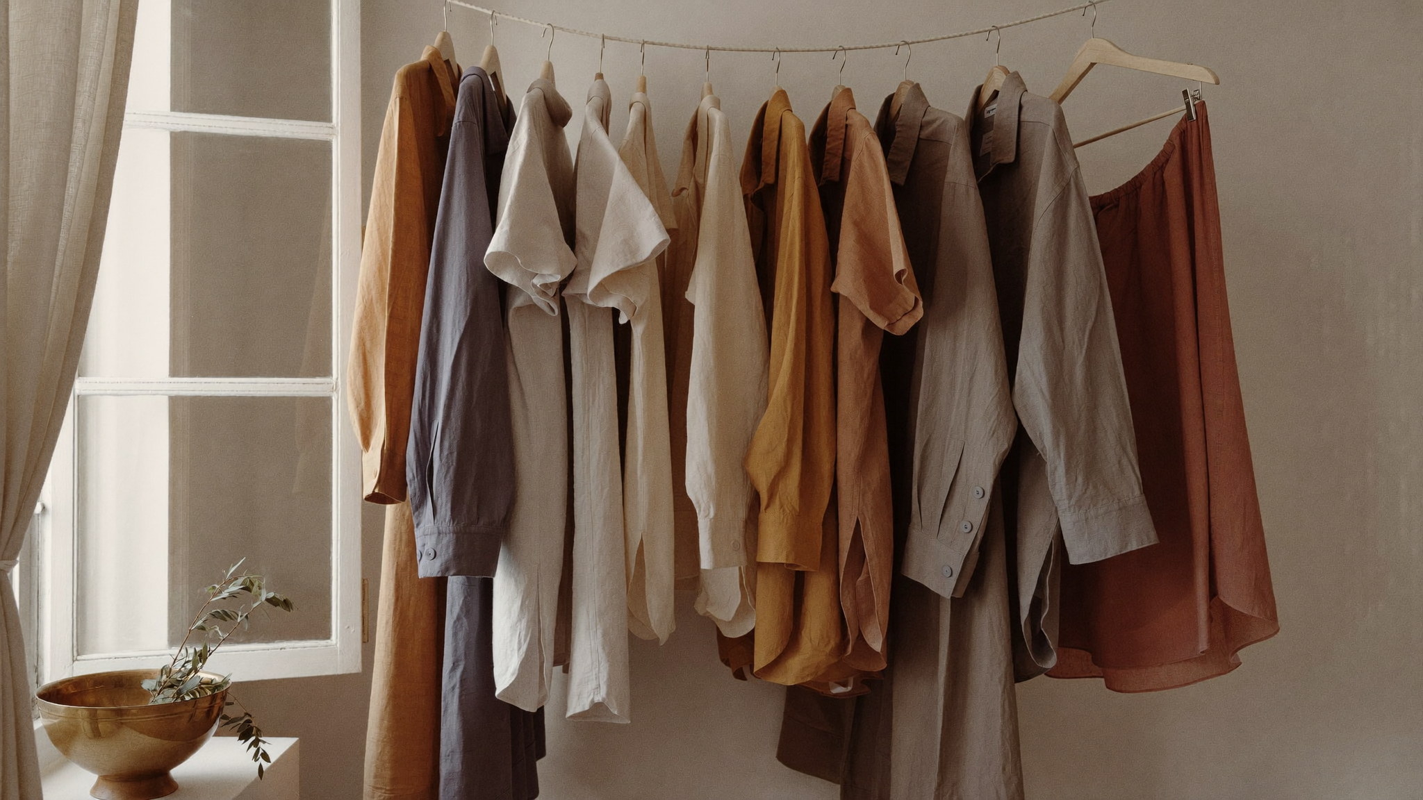 Linen shirts line-drying in soft window light — how to care for linen clothes in India