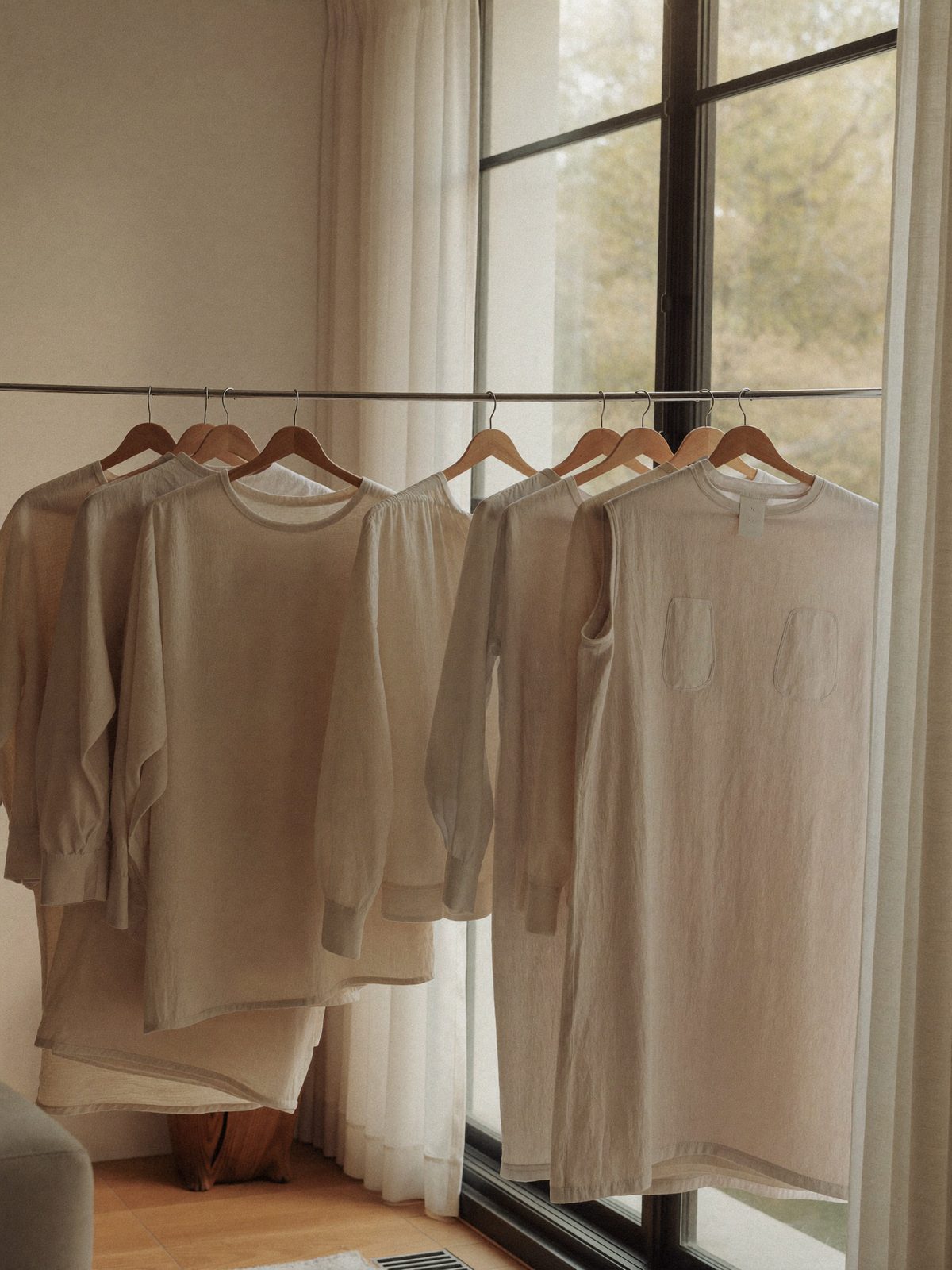 Linen garments air-drying by a sunlit window